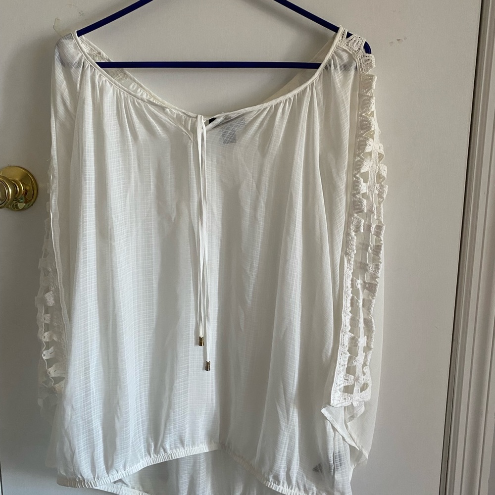 White blouse that is see through but a cami underneath helps